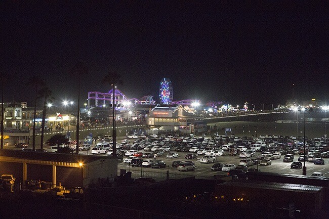 Aerial view of theme park and parking lot at night
