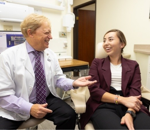 Woman laughing with Los Angeles cosmetic dentist Doctor Les Latner