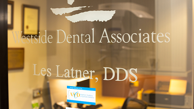 Sign on glass wall that reads Westside Dental Associates Les Latner D D S