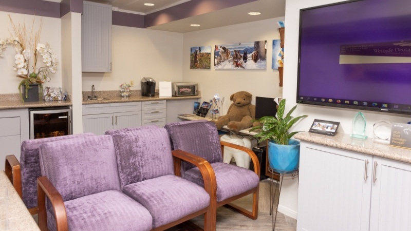 Purple chairs in dental office reception area