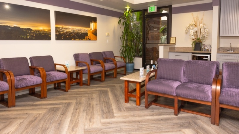 Row of purple chairs in waiting room