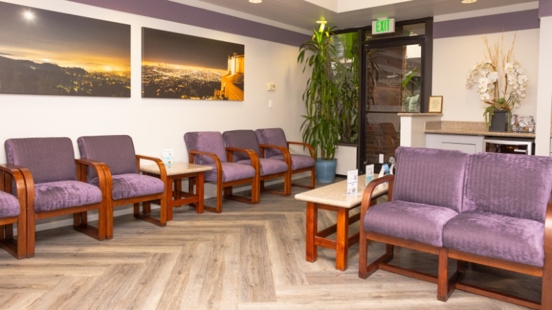 Purple chairs in dental office waiting room