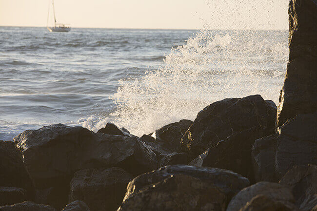 Ocean waves crashing against rocky shore