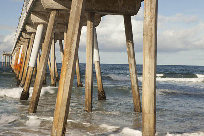 Wooden support beams underneath boardwalk