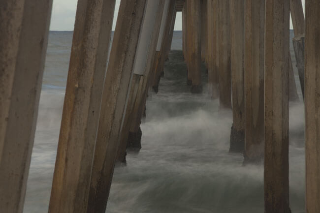 Ocean waves underneath boardwalk