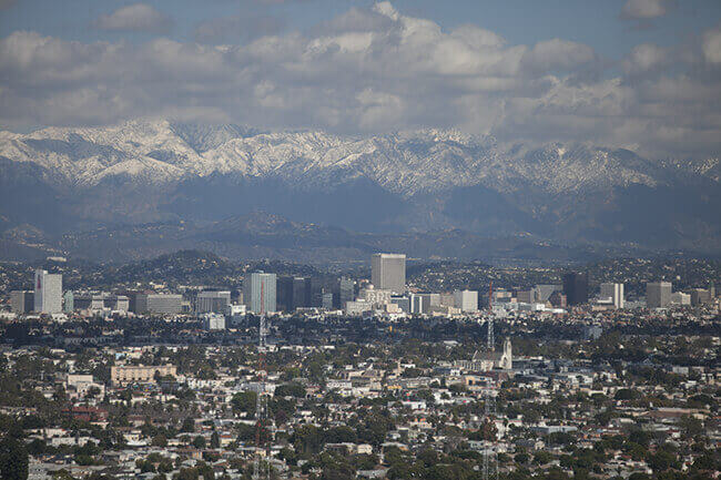 City skyline with mountains in background