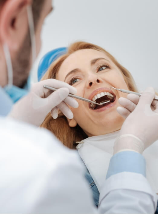 Woman receiving preventive dentistry exam