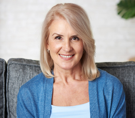 Older woman smiling after root canal treatment in Los Angeles 