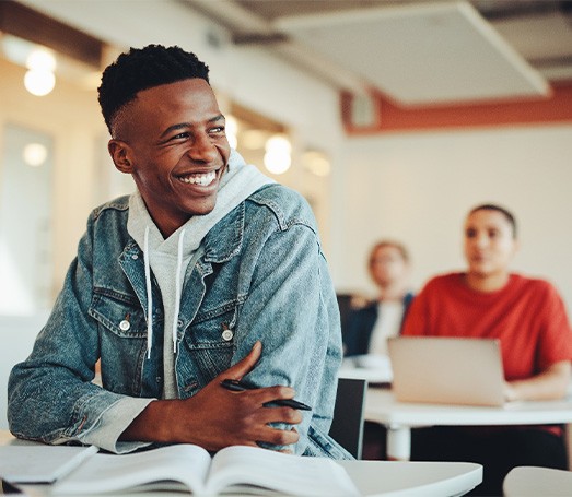 Student smiling in classroom