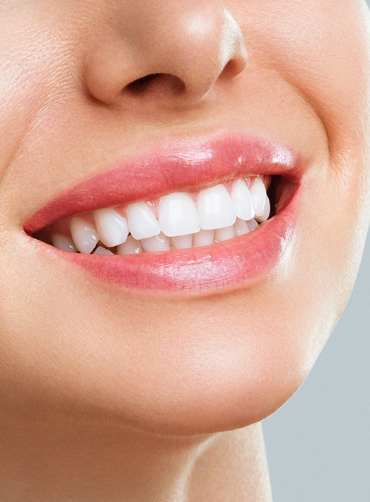 Nose-to-chin view of woman smiling with bright white teeth