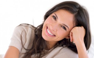 woman with a beautiful smile thanks to porcelain veneers los angeles loves