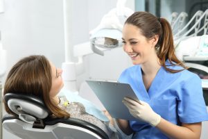 Dentist talking with patient