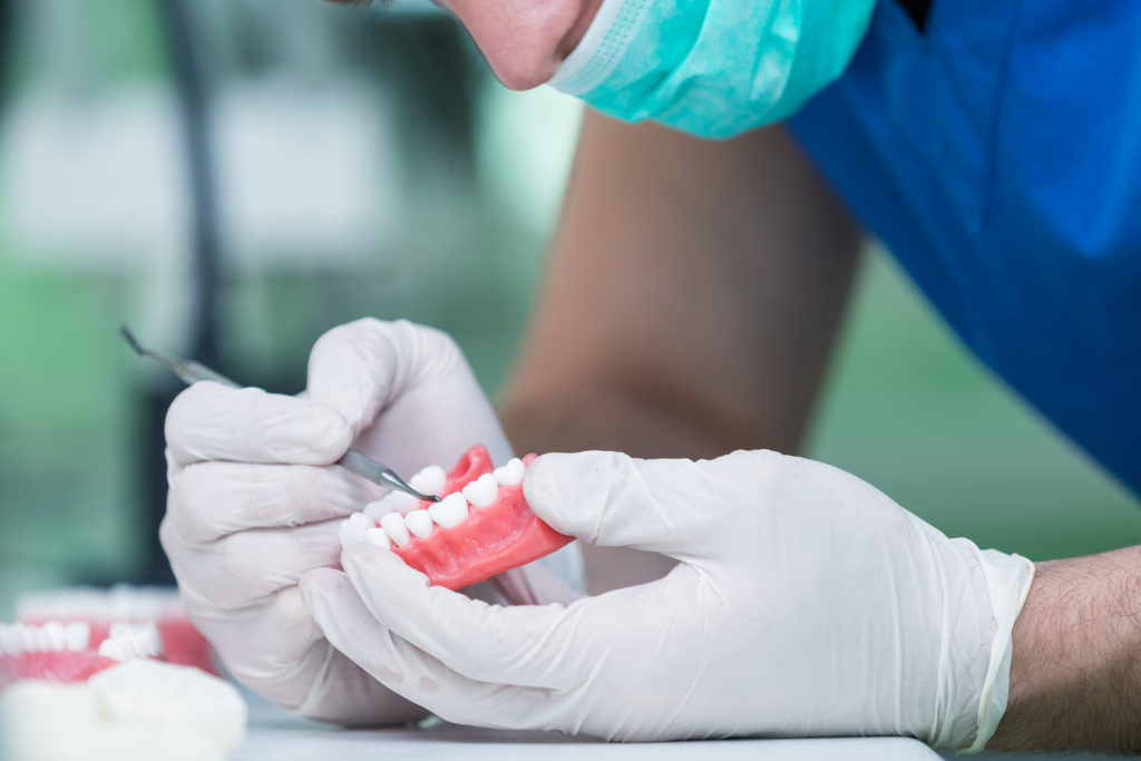 Dentist cleans dentures in Los Angeles