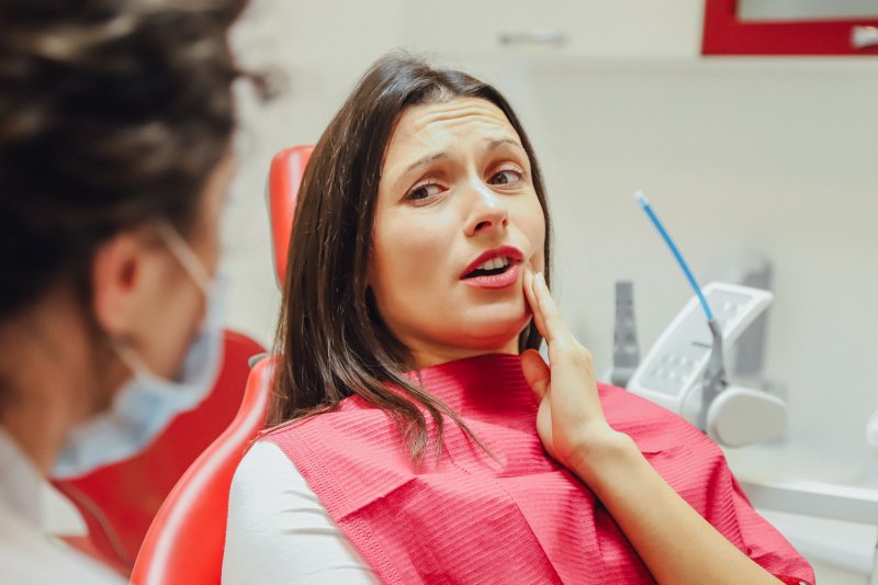 Woman at dentist addressing toothache in Los Angeles