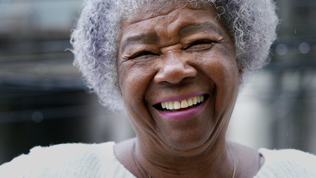 smiling older woman wearing dentures